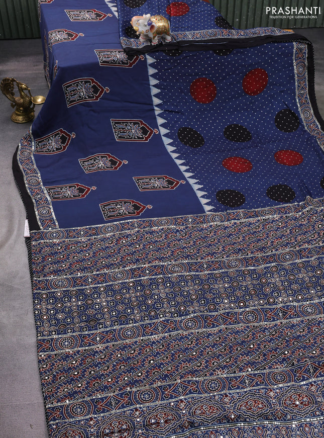 Modal silk saree blue and black with allover ajrakh prints and sequin embroidered work pallu