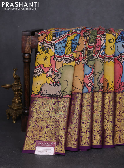 Pure kanchipuram silk saree peach shade and purple with allover penkalamkari prints and long rich annam zari woven border