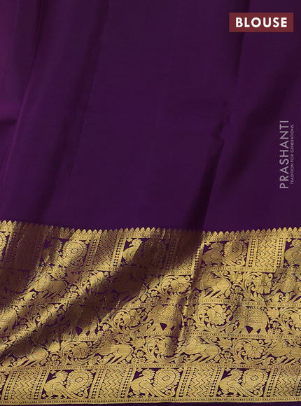 Pure kanchipuram silk saree peach shade and purple with allover penkalamkari prints and long rich annam zari woven border