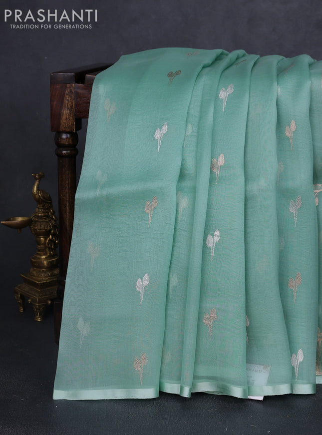 Banarasi organza silk saree pastel green with silver & gold zari woven buttas and piping border