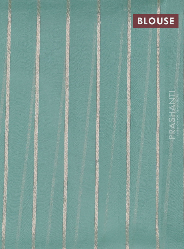 Banarasi organza silk saree pastel green with silver & gold zari woven buttas and piping border