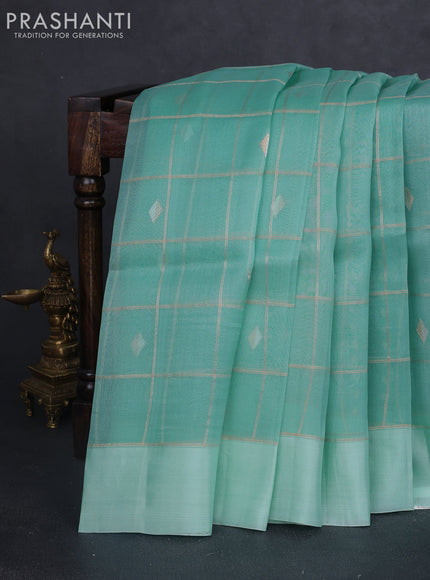 Banarasi organza silk saree teal blue with allover zari checks & buttas and simple border
