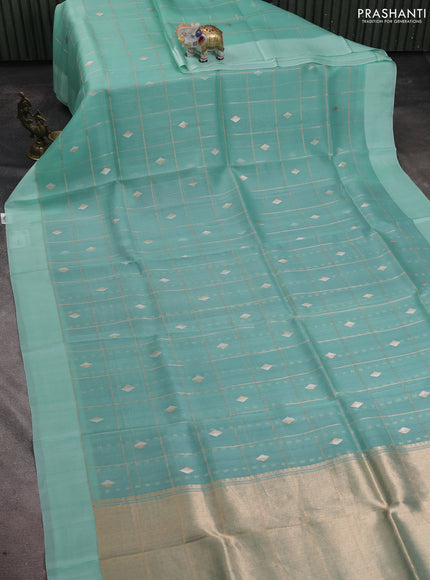 Banarasi organza silk saree teal blue with allover zari checks & buttas and simple border