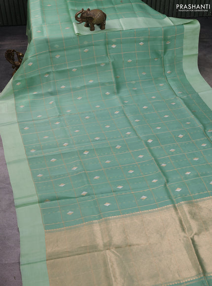 Banarasi organza silk saree pastel green with allover zari checks & buttas and simple border