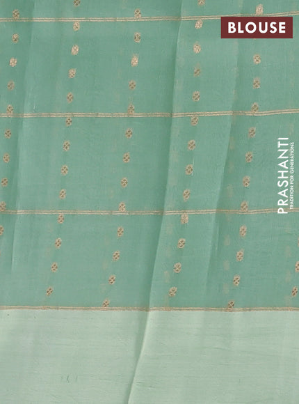 Banarasi organza silk saree pastel green with allover zari checks & buttas and simple border