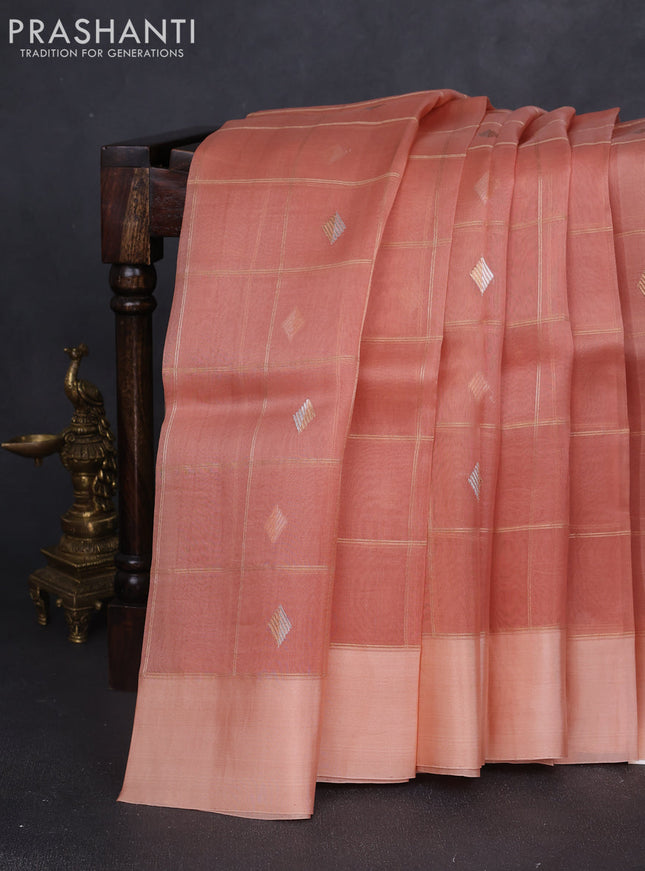 Banarasi organza silk saree peach orange with allover zari checks & buttas and simple border