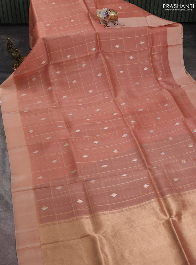 Banarasi organza silk saree peach orange with allover zari checks & buttas and simple border