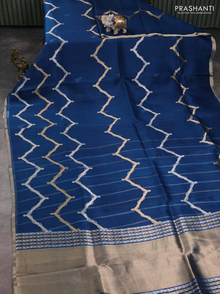 Banarasi organza silk saree peacock blue with allover silver & gold zig zag zari weaves and zari woven border
