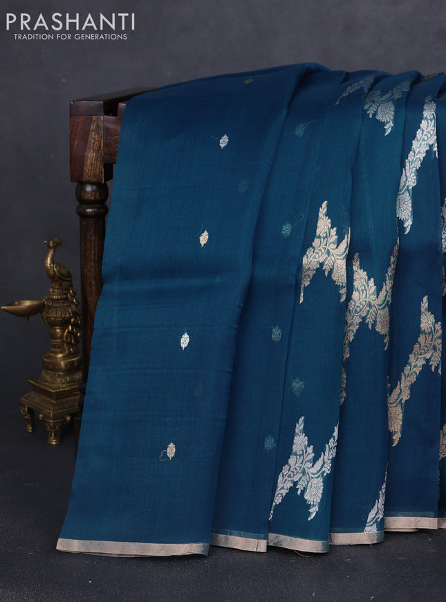 Banarasi organza silk saree peacock blue with allover silver & gold zari weaves and zari woven border