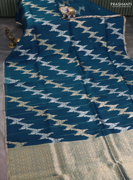 Banarasi organza silk saree peacock blue with allover silver & gold zari weaves and zari woven border
