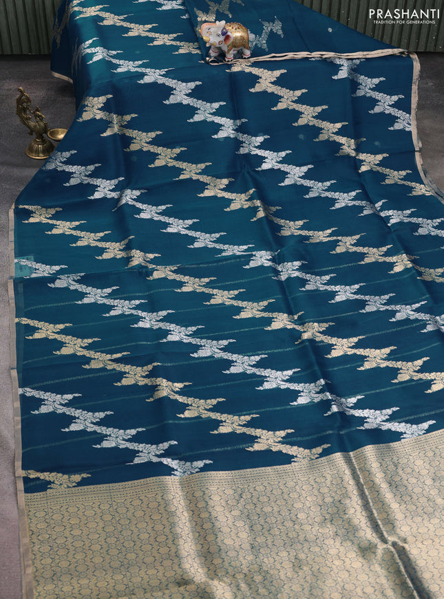 Banarasi organza silk saree peacock blue with allover silver & gold zari weaves and zari woven border