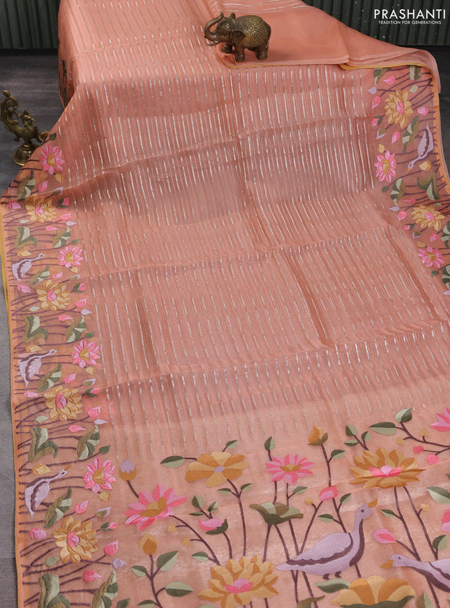 Pure organza silk saree peach shade and pale yellow with allover silver zari weaves and floral embroidery border
