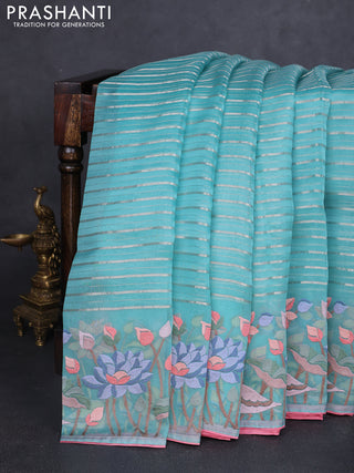 Pure organza silk saree teal green and peach pink with allover silver zari weaves and floral embroidery border