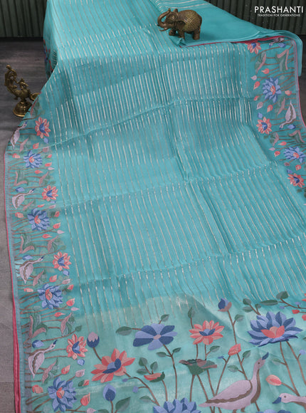 Pure organza silk saree teal green and peach pink with allover silver zari weaves and floral embroidery border