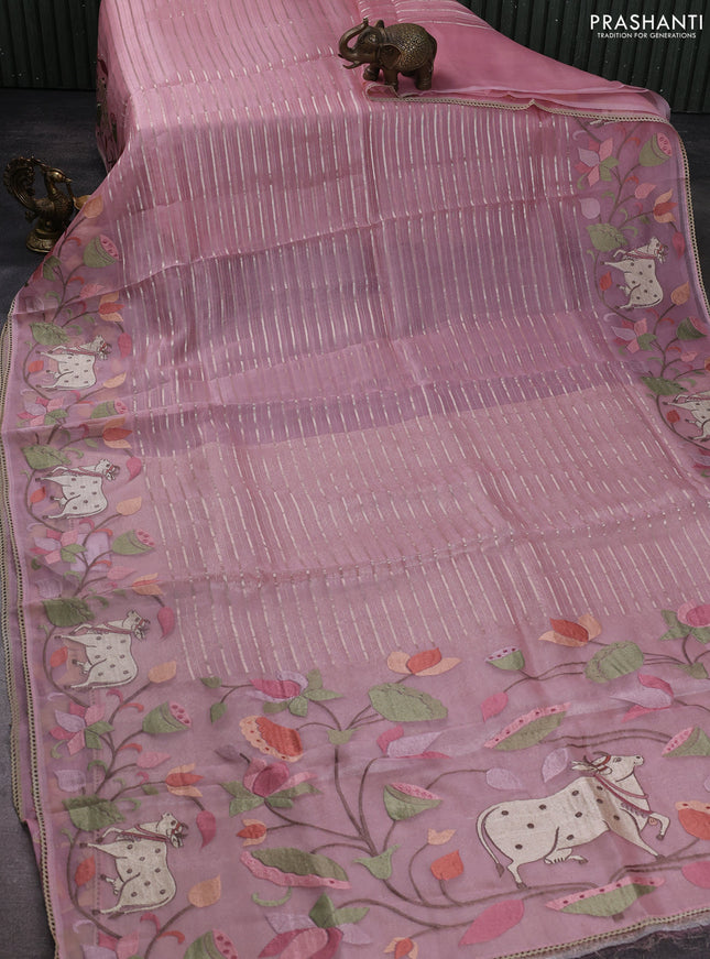 Pure organza silk saree peach shade with allover silver zari weaves and pichwai embroidery border