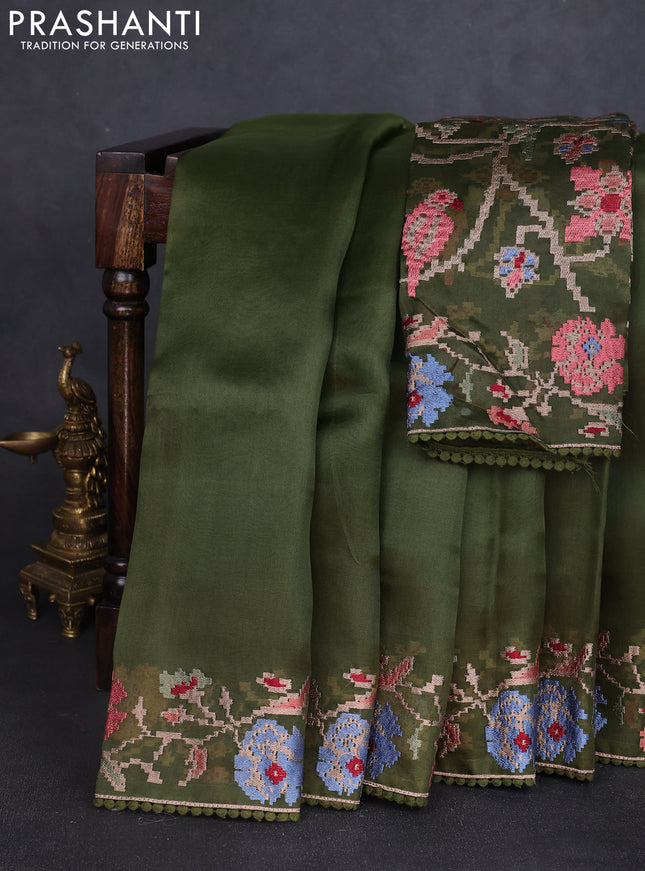 Pure organza silk saree sap green with plain body and floral embroidery border