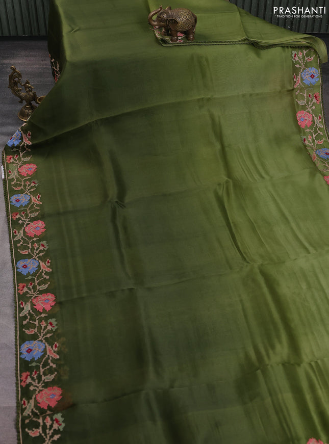 Pure organza silk saree sap green with plain body and floral embroidery border