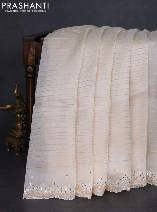 Pure organza silk saree off white with allover zari weaves and sequin mirror work border