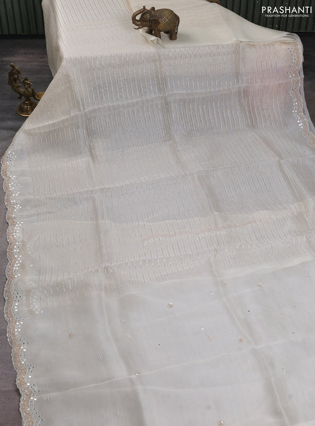 Pure organza silk saree off white with allover zari weaves and sequin mirror work border
