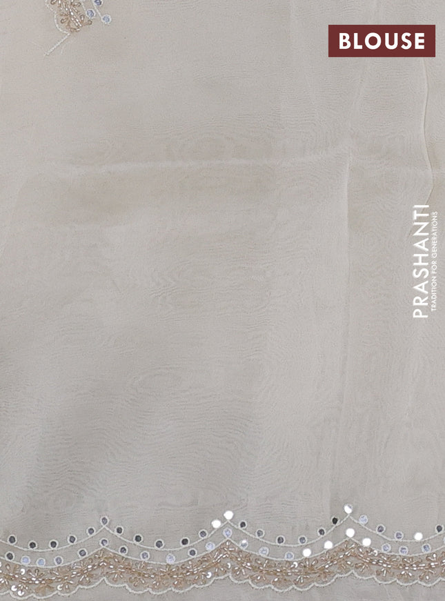 Pure organza silk saree off white with allover zari weaves and sequin mirror work border