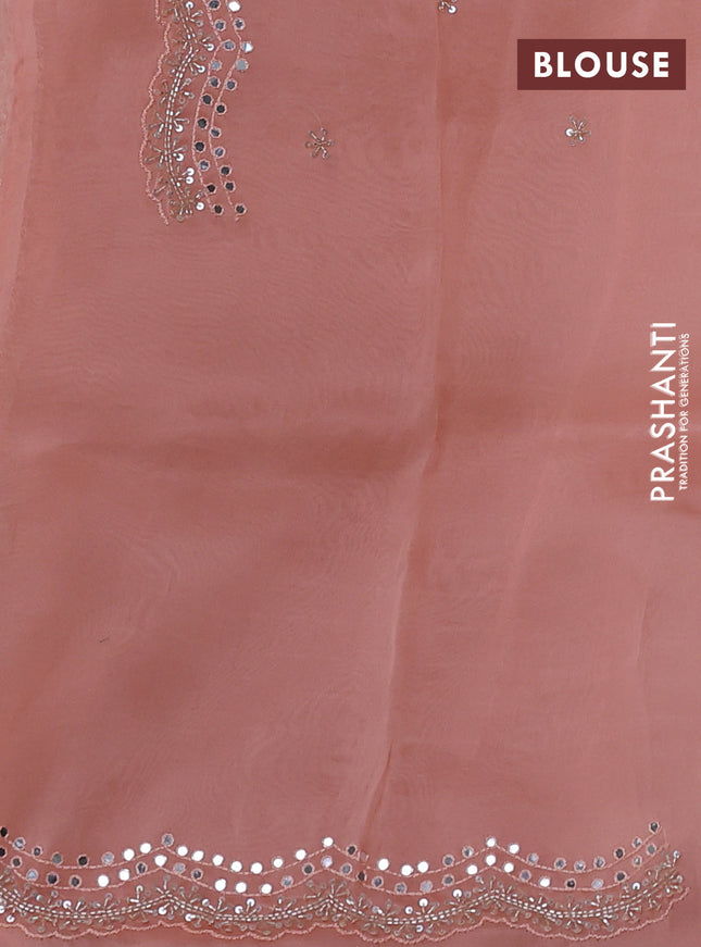 Pure organza silk saree peach orange with allover zari weaves and sequin mirror work border