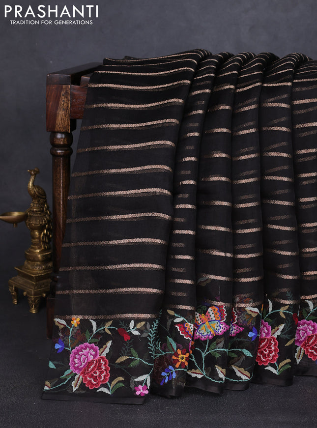 Pure organza silk saree black with allover zari weaves and floral embroidery border