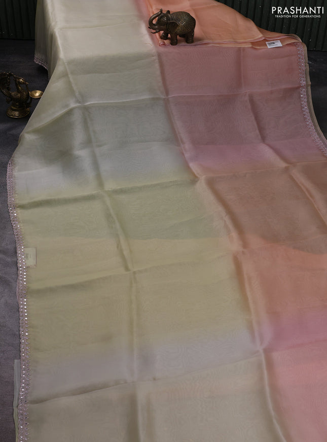 Pure organza silk saree pale yellow and peach with plain body and embroidery mirror work border