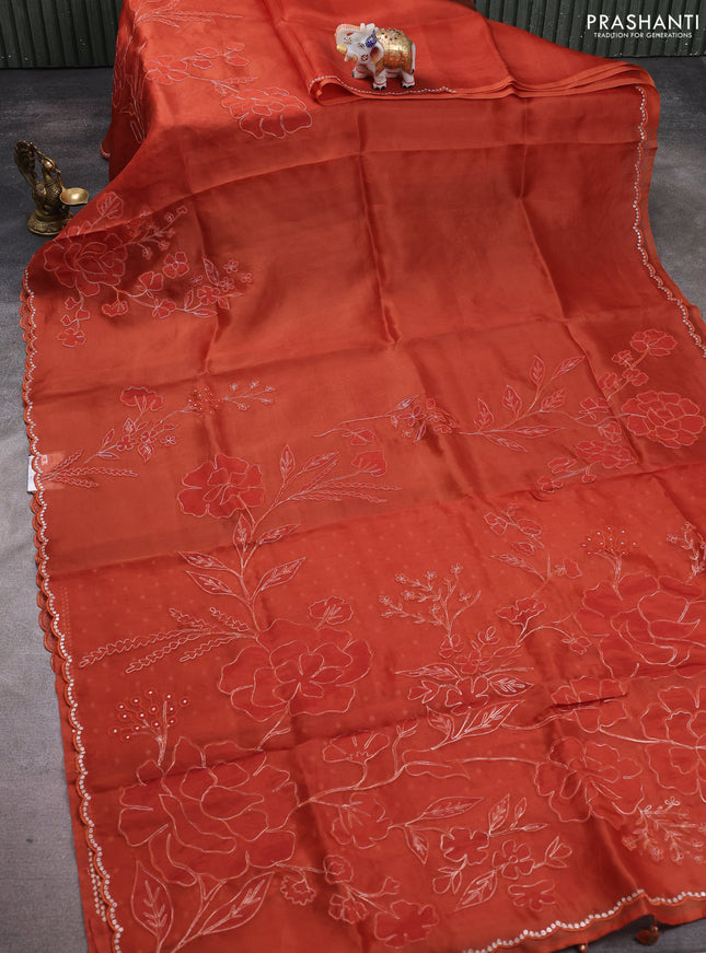 Pure organza silk saree rust shade with floral embroidery work and scalp border