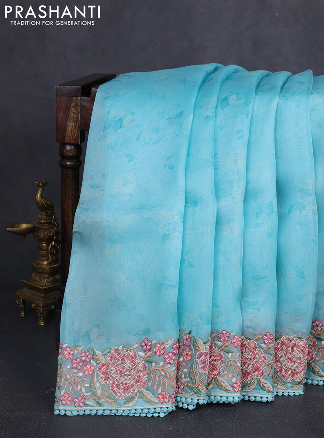 Pure organza silk saree teal blue with floral prints and floral embroidery border