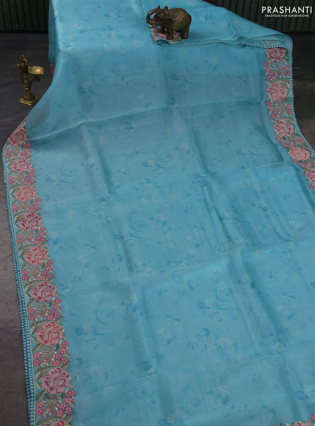 Pure organza silk saree teal blue with floral prints and floral embroidery border