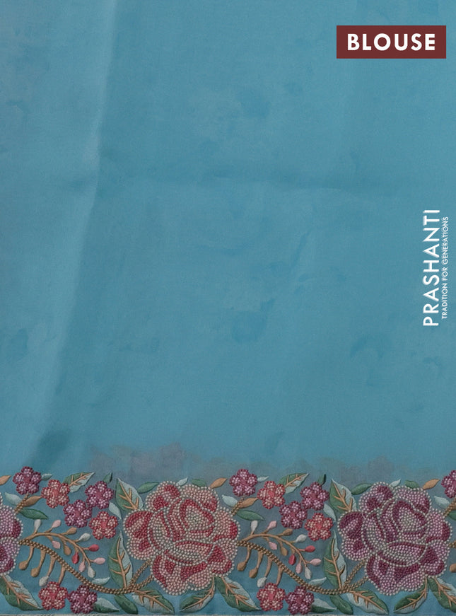 Pure organza silk saree teal blue with floral prints and floral embroidery border