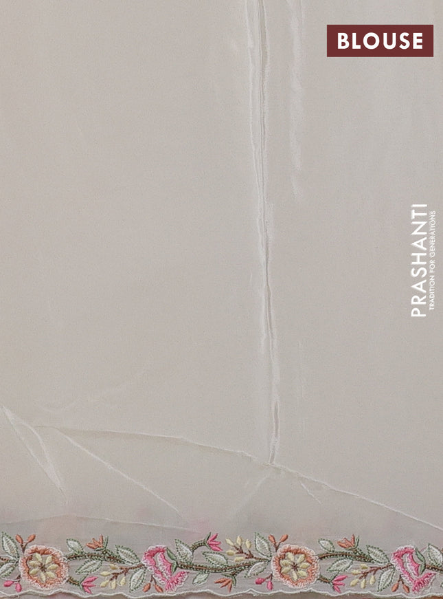 Pure organza silk saree off white with allover embroidery work and floral embroidery border