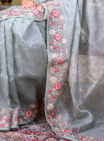 Pure organza silk saree pastel green with allover embroidery work and floral embroidery border