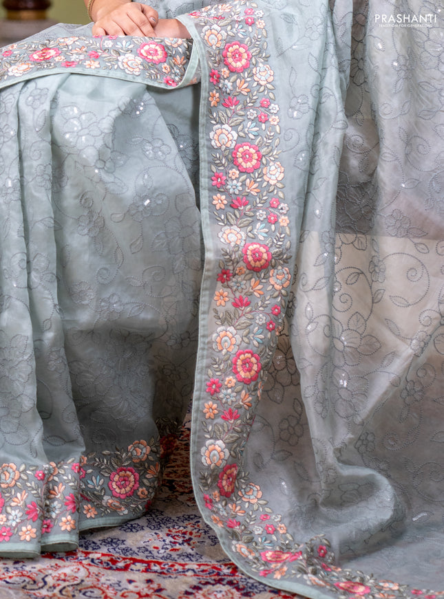 Pure organza silk saree pastel green with allover embroidery work and floral embroidery border