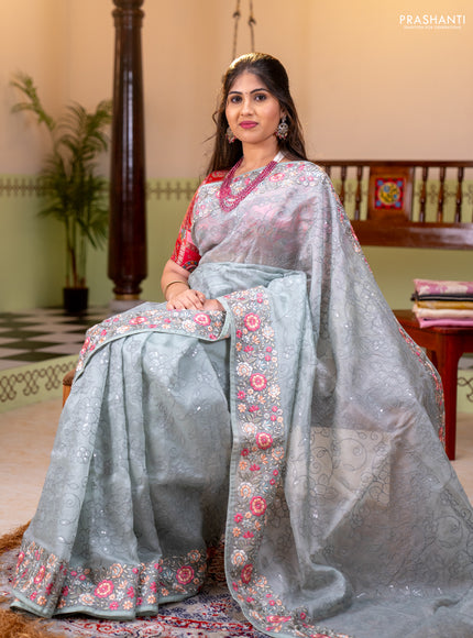 Pure organza silk saree pastel green with allover embroidery work and floral embroidery border