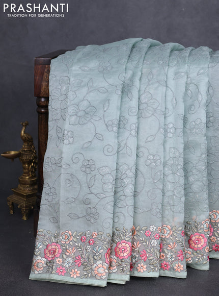 Pure organza silk saree pastel green with allover embroidery work and floral embroidery border