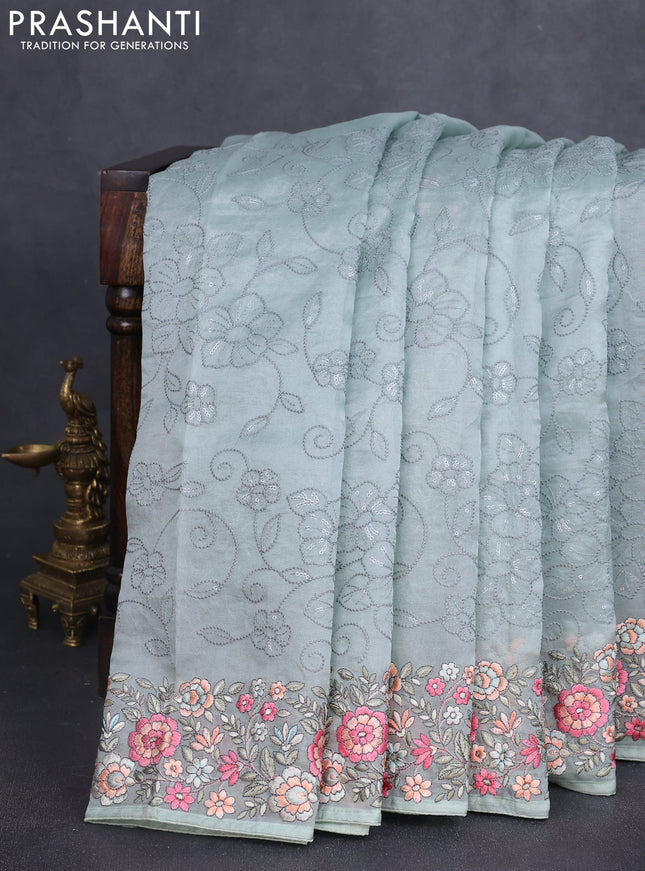 Pure organza silk saree pastel green with allover embroidery work and floral embroidery border
