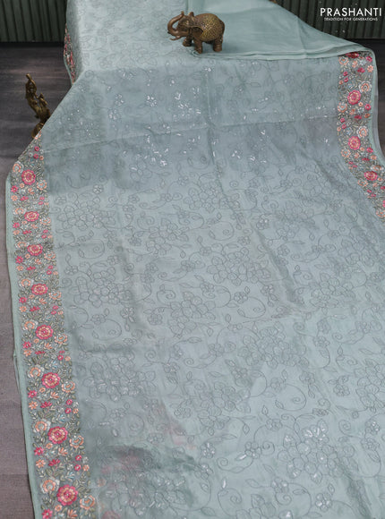 Pure organza silk saree pastel green with allover embroidery work and floral embroidery border