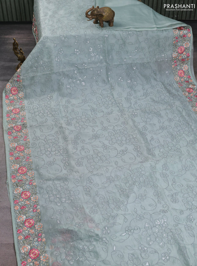 Pure organza silk saree pastel green with allover embroidery work and floral embroidery border