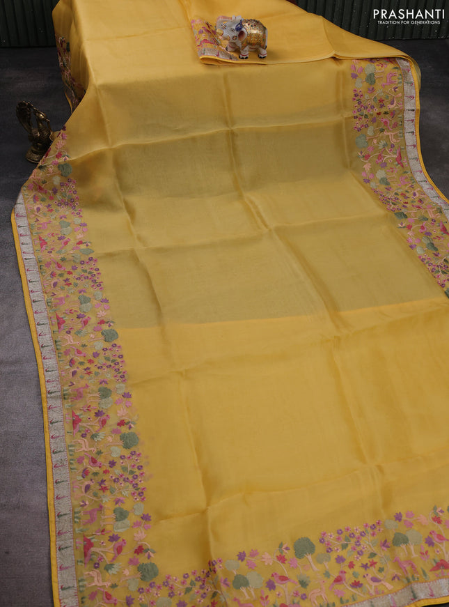 Pure organza silk saree yellow with plain body and embroidery work border
