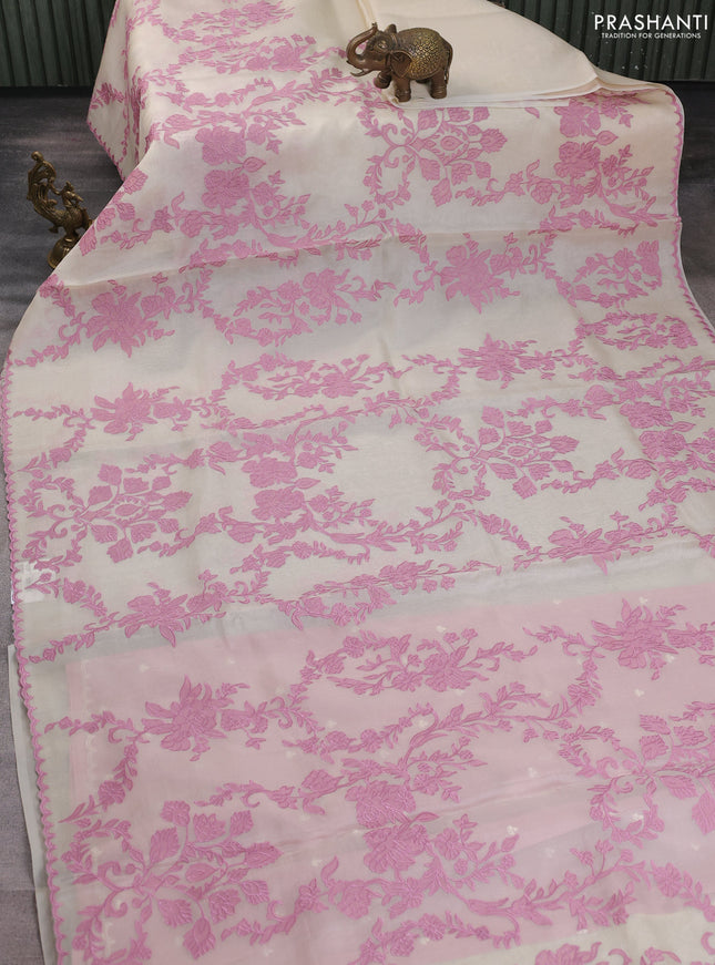 Pure organza silk saree cream and pink with allover appliqe work and scalap border