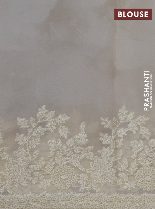 Pure organza silk saree cream with floral prints and floral embroidery border