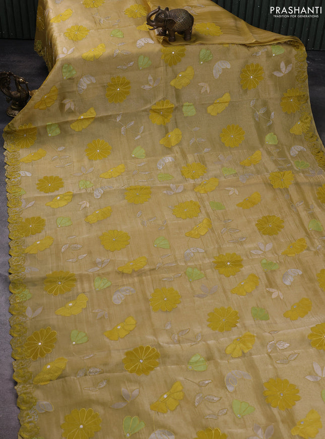 Pure tissue organza silk saree mustard shade with allover applique work and embroidery work border