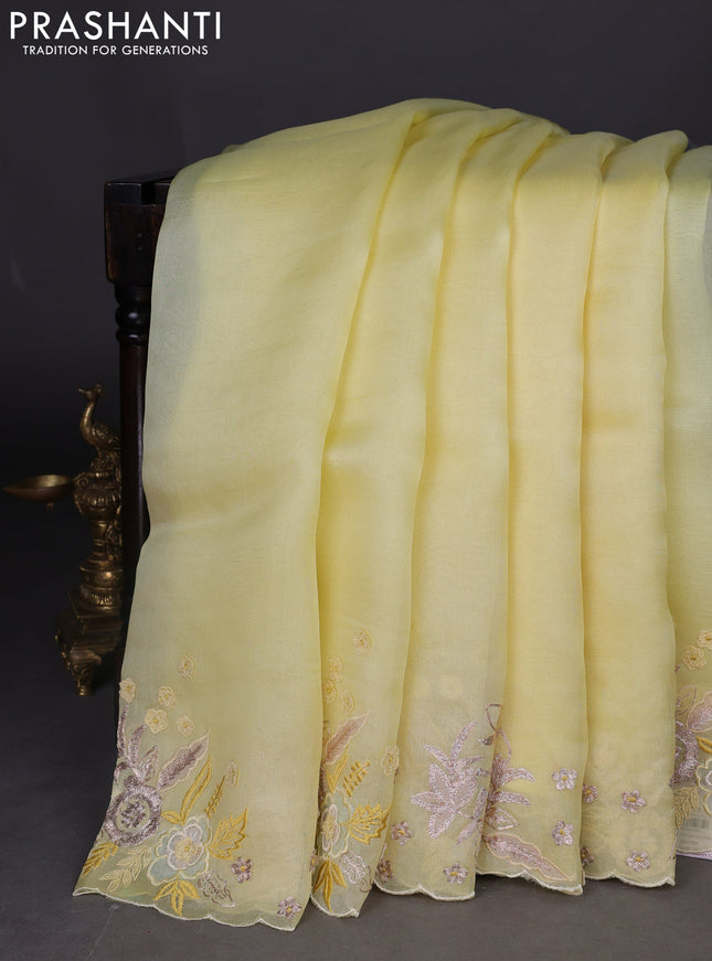 Pure organza silk saree pale yellow with plain body and embroidery border