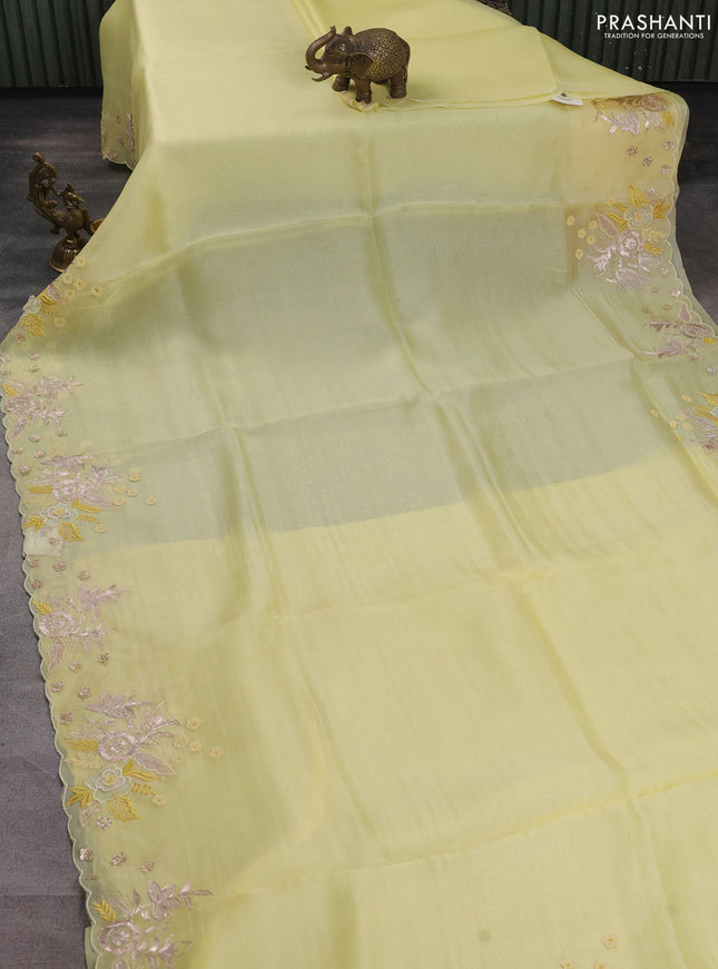 Pure organza silk saree pale yellow with plain body and embroidery border