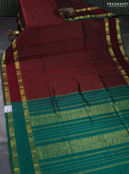 Silk cotton saree deep maroon and green with allover lakshadeepam pattern and rettapet zari woven border