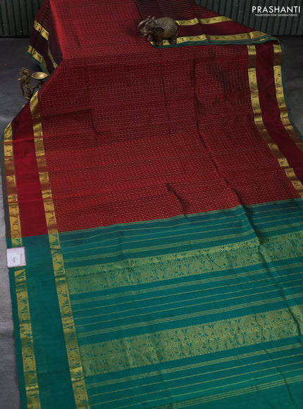Silk cotton saree deep maroon and green with allover lakshadeepam pattern and rettapet zari woven border