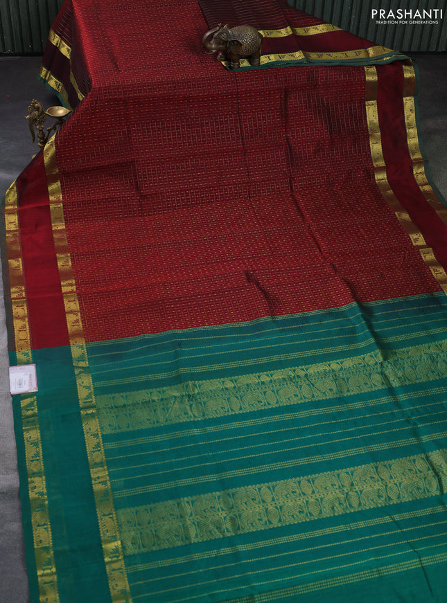 Silk cotton saree deep maroon and green with allover lakshadeepam pattern and rettapet zari woven border