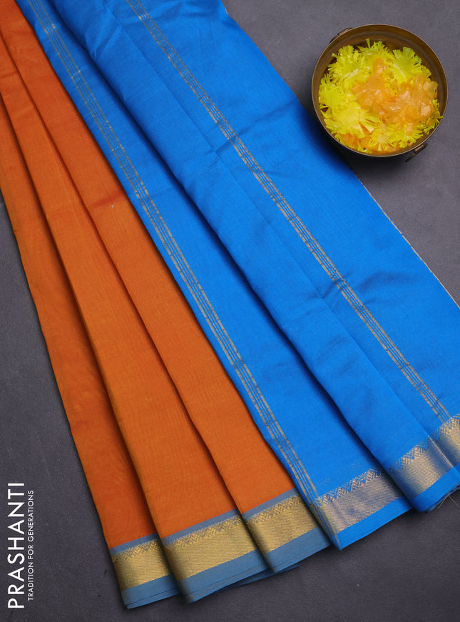 Silk cotton saree orange and cs blue with plain body and zari woven border
