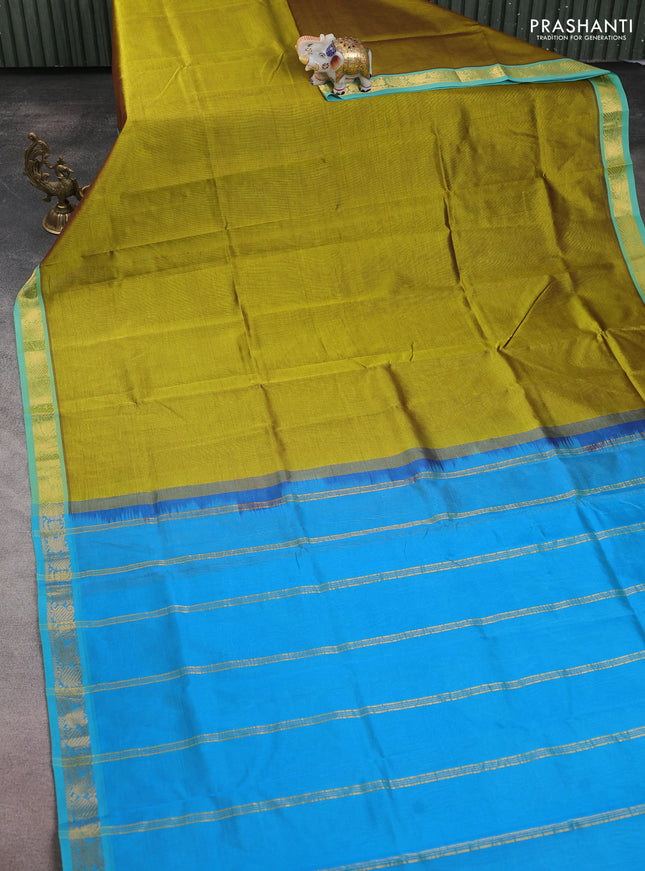 Silk cotton saree mehendi green and cs blue with plain body and zari woven border